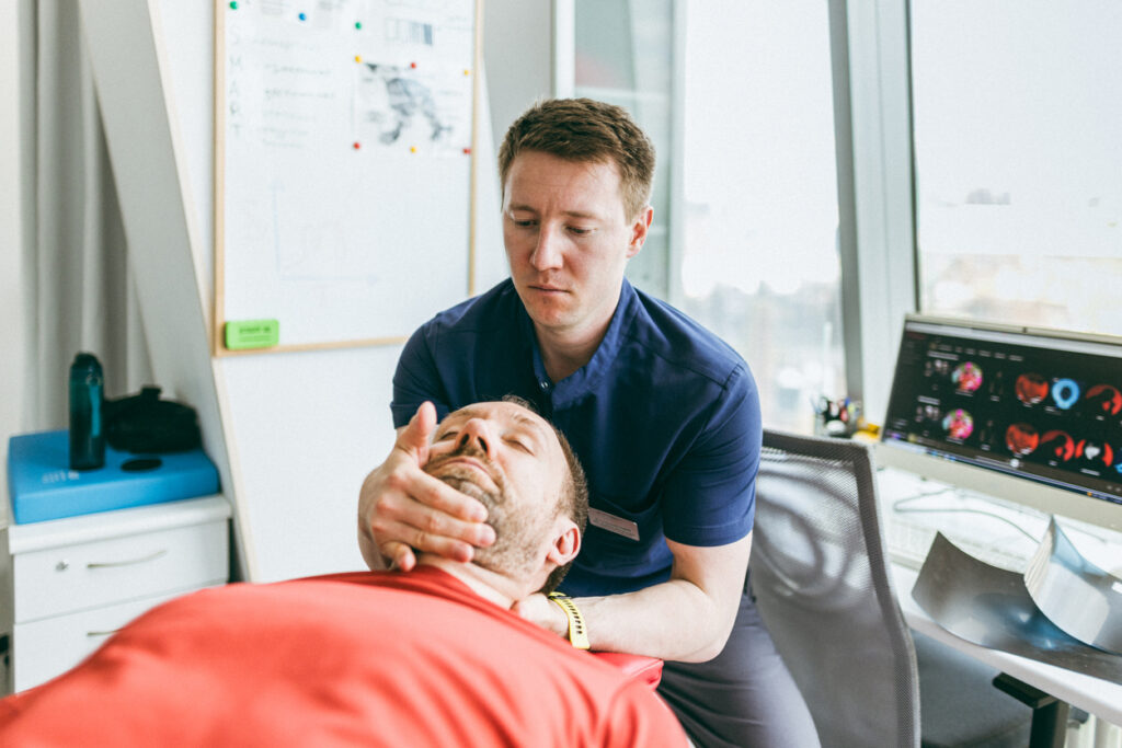 chiropractor working with a patient